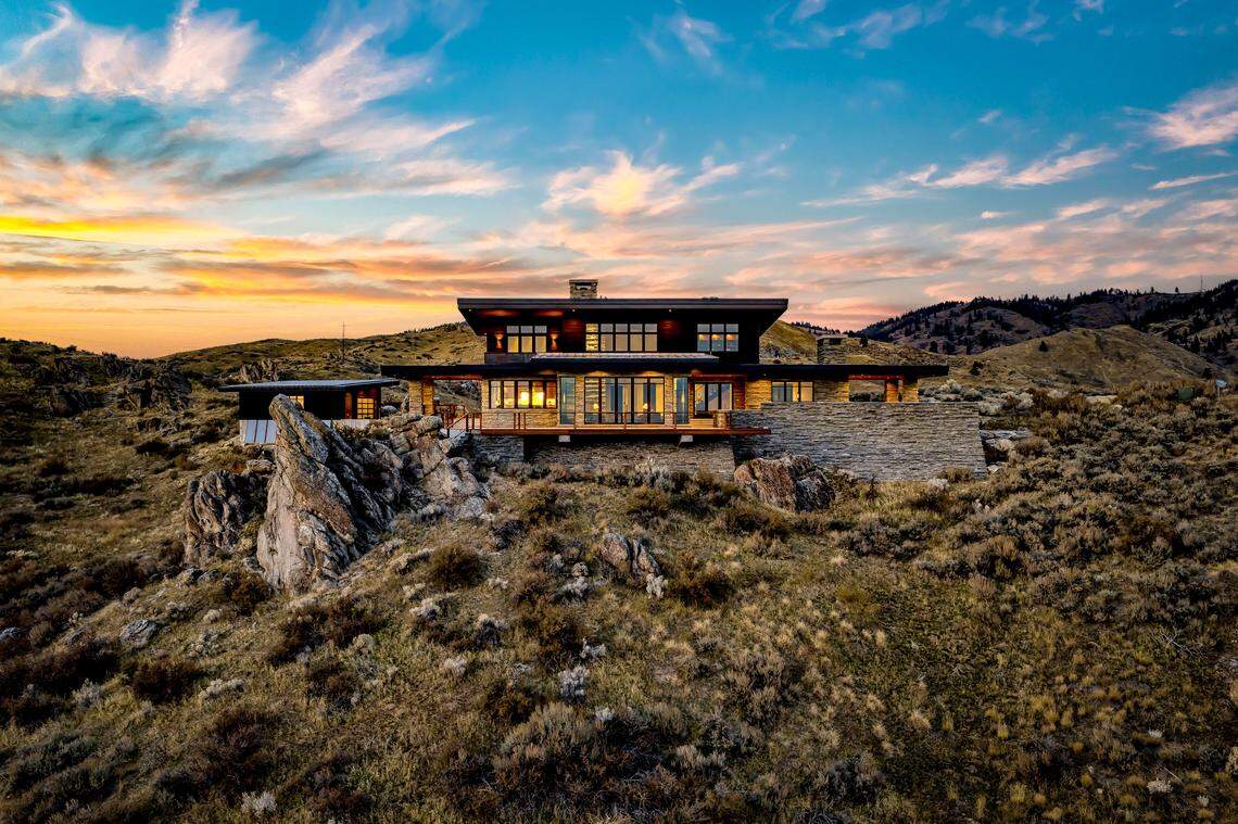 The four-bed house was designed to sit among the huge granite boulders already onsite.