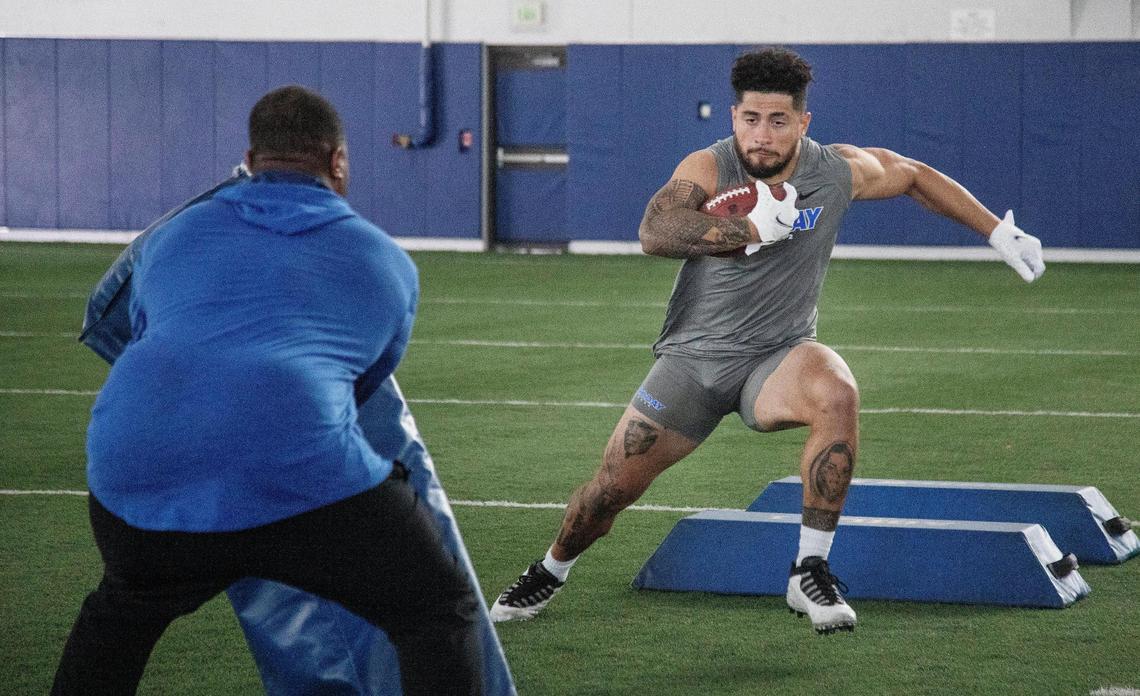 Boise State University football running back Cyrus Habibi-Likio runs a drill for Pro Day at the Caven-Williams Sports Complex on Wednesday, March 30, 2022.