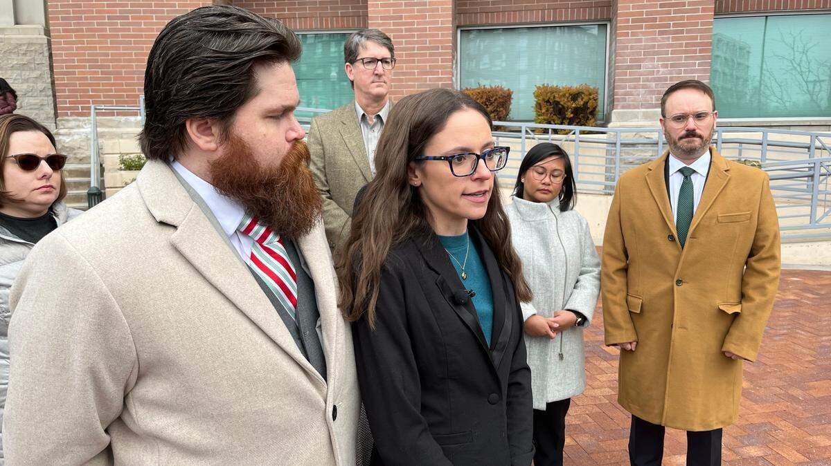 Jennifer Adkins, center, is a plaintiff in a lawsuit filed by several Idaho residents and doctors over the state’s abortion laws. A judge Friday dropped some defendants from the suit but allowed the case to advance.