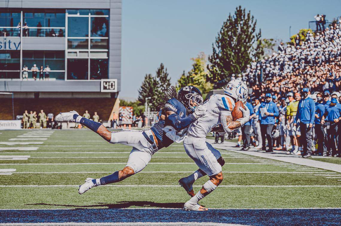 Boise State senior receiver Khalil Shakir scores on a 3-yard touchdown pass from Hank Bachmeier in the third quarter. The Broncos defeated Utah State 27-3 on Saturday in Logan, Utah.