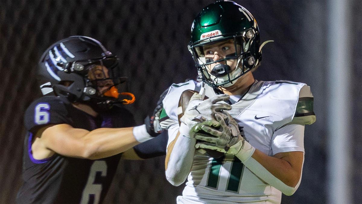 Eagle wide receiver Gavin Crawford secures a pass defended by Rocky Mountain’s Trey Jacobsen in the 6A SIC championship game Oct. 25.