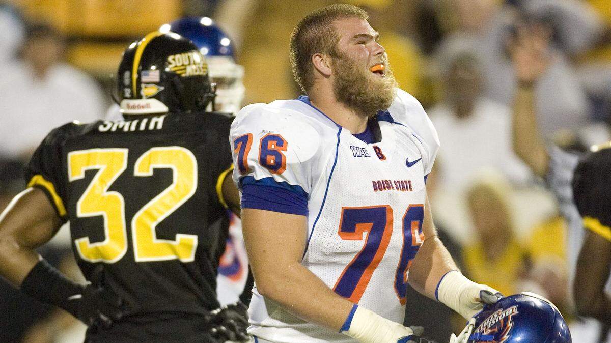 After losing his helmet late in the fourth quarter, Boise State offensive lineman Jon Gott takes a look at the 24-7 advantage on the scoreboard as the seconds tick off the clock at Southern Miss in 2008.