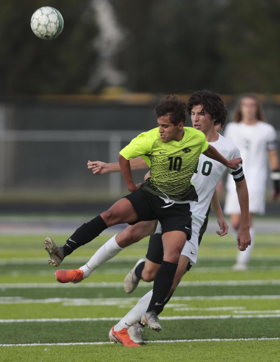 Borah’s Carlos Camacho, front, battles for control of the ball during the 2019 5A District Three boys soccer championship game.