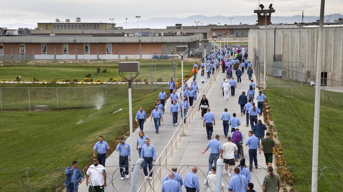 Inmates at the Idaho State Correctional Institution move through the grounds on a changeover Oct. 2, 2018.