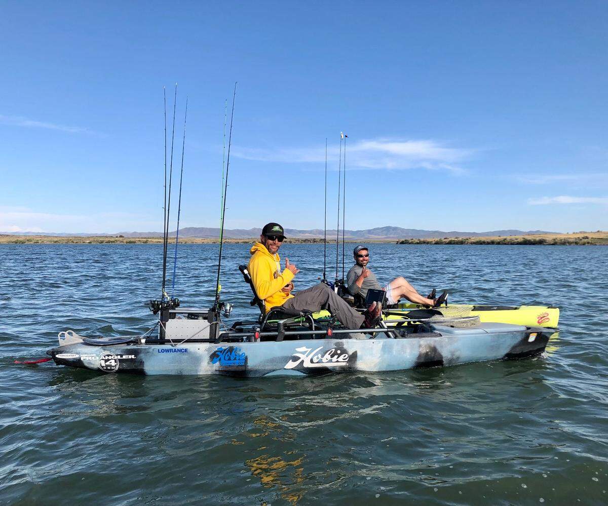 Kayak tournament angler Kyle Zemke of Burley and Caleb Nichols pedal across Lake Walcott in Hobie kayaks — specifically engineered fishing machines that carry a boatload of fish-catching features.
