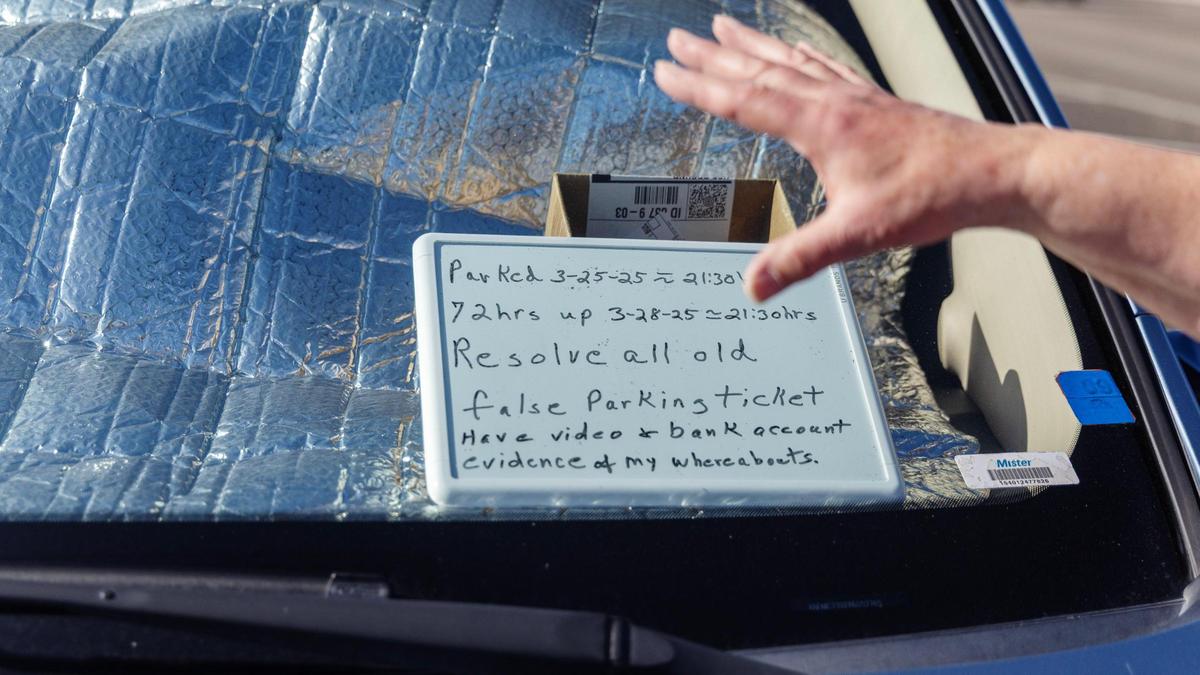 Celia Harrison leaves a note on her dashboard to try to avoid parking tickets. She expressed frustration that police focused on ticketing but did not respond to her requests for help when she was harassed.