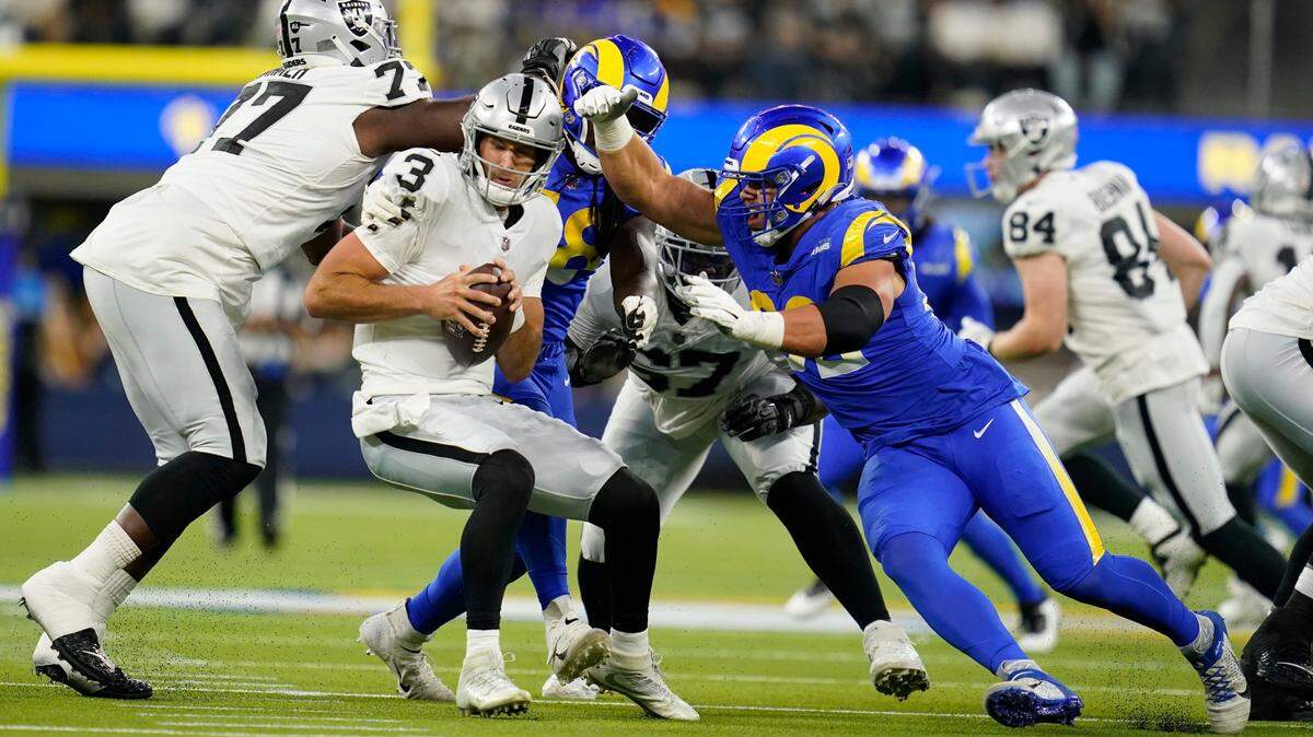 Las Vegas Raiders quarterback Nathan Peterman is tackled by Los Angeles Rams defensive end Jonah Williams, a Rocky Mountain High graduate, during the second half of a preseason NFL football game Aug. 21 in Inglewood, Calif. Williams was a member of the Rams’ practice squad last season, and he made the 53-man roster in 2021.