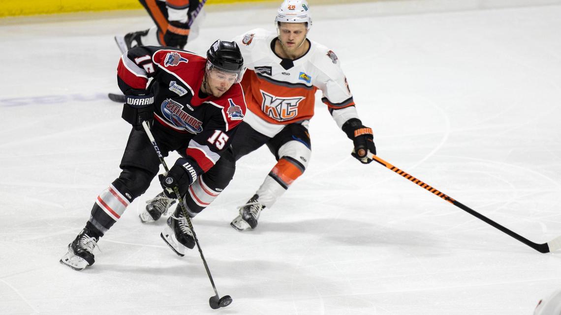 Idaho Steelheads forward Ryan Dmowski passes the puck on March 29.