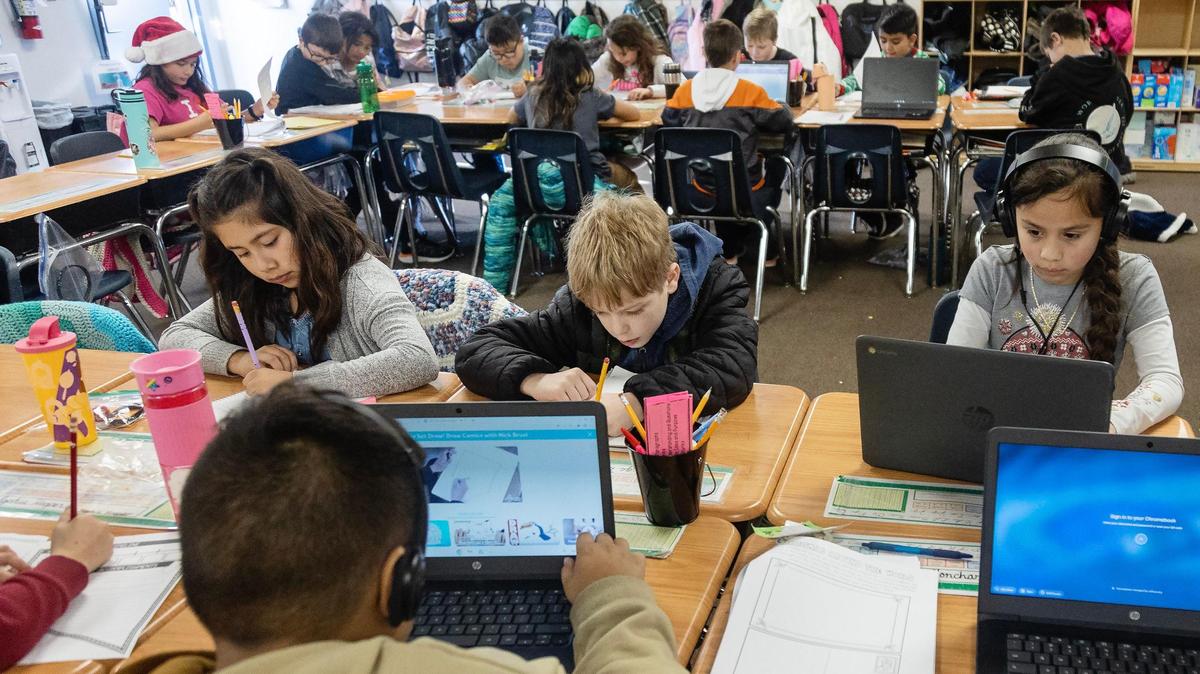 Fourth graders at Lakevue Elementary School in Nampa work on a recent winter day. The school is hundreds of students over capacity, so these students are housed in a portable classroom.