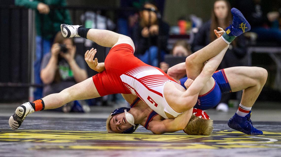 New Plymouth’s Kyle Rice, back, looks for the advantage on opponent Clayton Lunt in the 2A 120-pound state wrestling championship Saturday, Feb. 29, 2020 at Ford Idaho Center in Nampa. Rice won the title match.