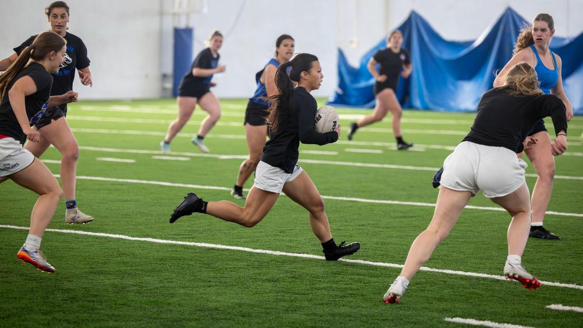 Scrum-half Hannah Nguyen sprints with the ball during a Boise State women’s rugby practice at Caven-Williams Sports Complex in Boise.