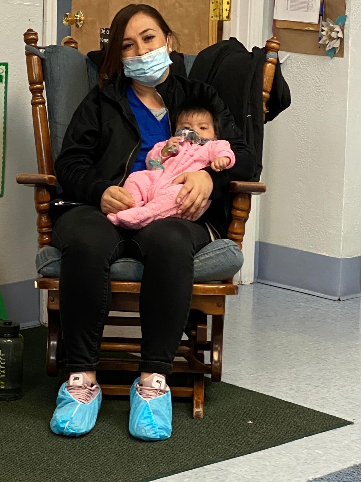 Alondra Sanchez cares for a child at the Casa de Colores center in Caldwell. It was one of several Migrant and Seasonal Head Start Centers in Idaho to close because of coronavirus concerns.