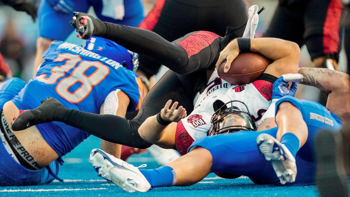 Boise State edge George Tarlas sacks San Diego State quarterback Braxton Burmeister, who later was injured and knocked out of the game.