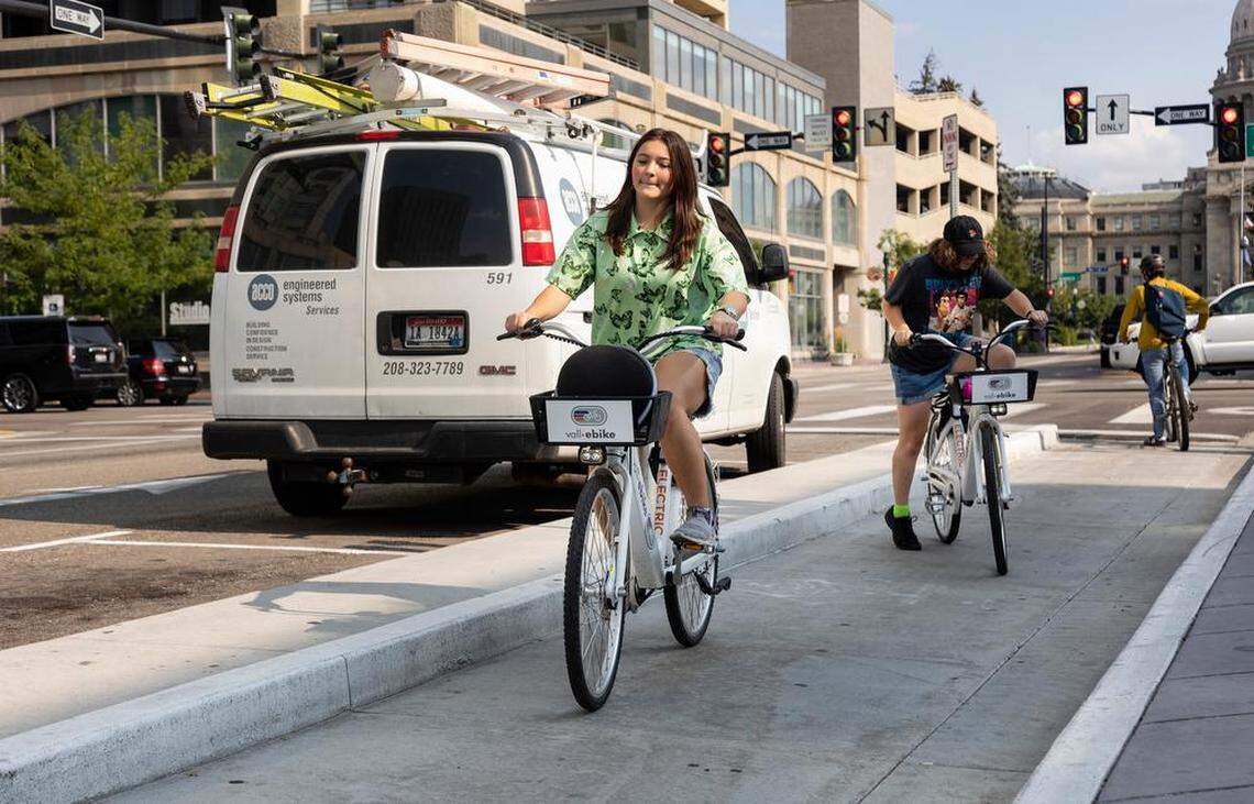 Sisters Ryane Johnson, 13, and Taylor Johnson, 15, hop on electric bicycles called Vall-eBike that were parked in front of Boise City Hall on Wednesday, Sept. 14. Vall-eBike is a shared bicycle rental that is in a pilot program in Boise. Fifty electric-assist bicycles became available in July.