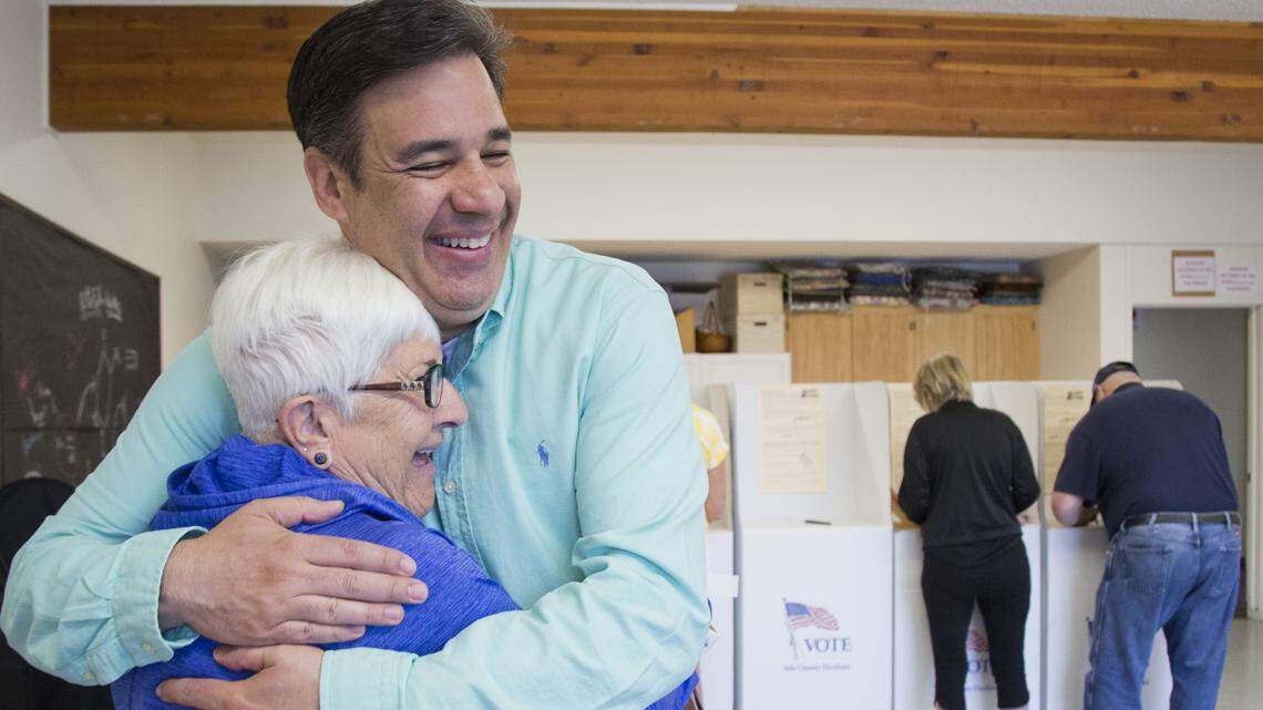 Idaho Congressman and then-Republican gubernatorial candidate Raul Labrador gets a hug from poll worker Jackie Dahl after Labrador cast his ballot in the May 15, 2018, primary.