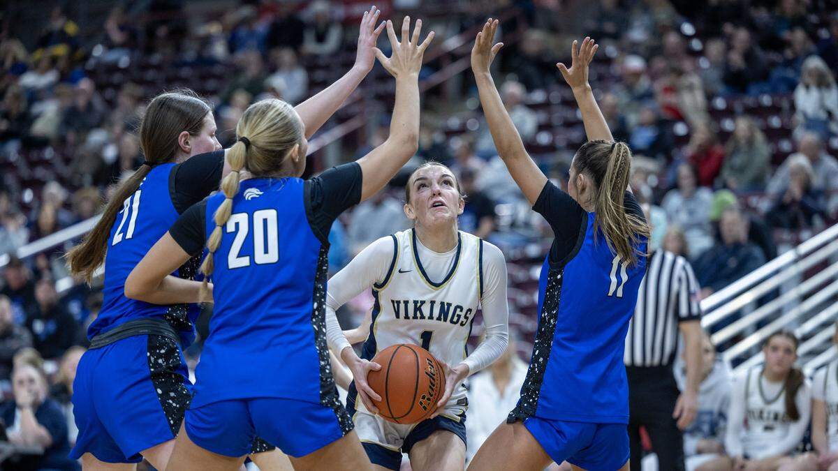 Timberline's defense collapses on Middleton's Zoey Blackwell but she scores anyway in the first round of the 6A girls basketball state tournament at Ford Idaho Center in Nampa, Thursday, Feb. 19, 2026.