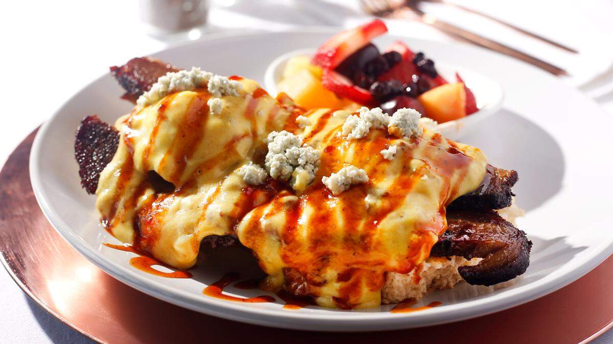 At Blue Bench’s sister operation, Huck House Brunchette, benedicts include the Brisket, Biscuit, Bacon, and Blues ($17.99), “golden-grilled scratch-made biscuit topped with 12-hour smoked beef brisket, farm fresh poached eggs, sweet bacon Hollandaise sauce, crumbled blue cheese and drizzled in homemade bbq sauce.”