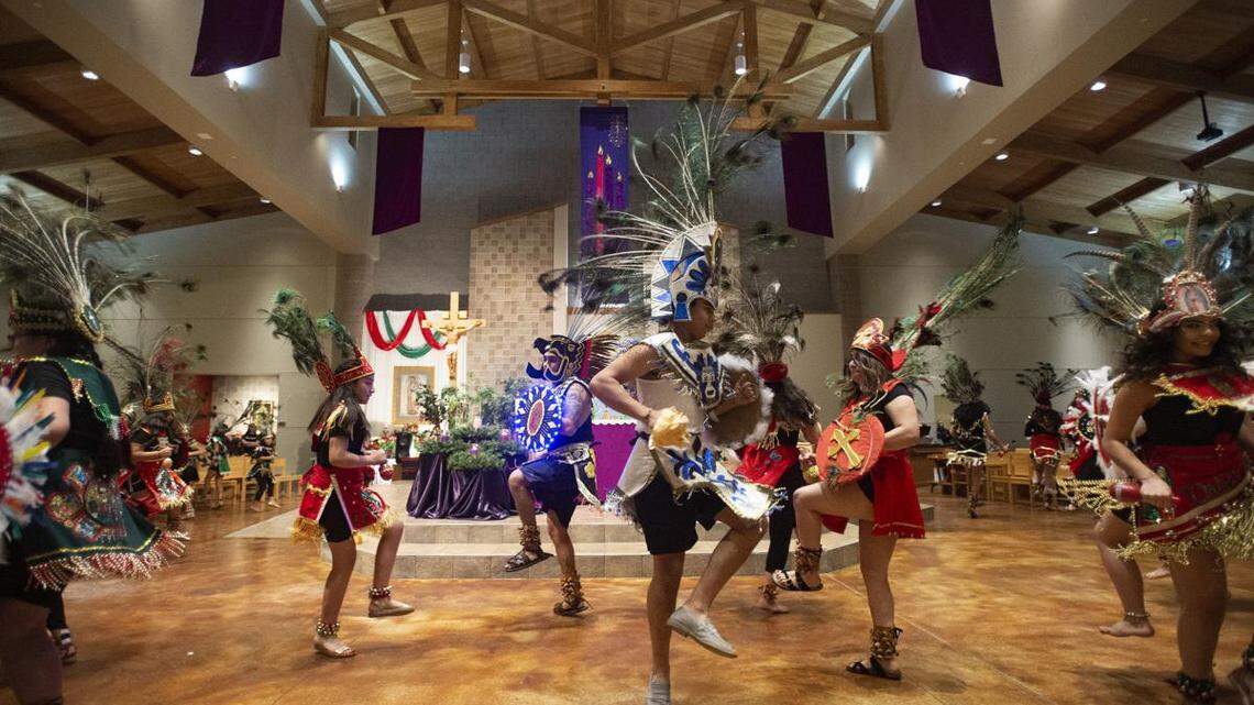 Worshippers gather for the Serenade of the Precious Mother at St. Jerome Catholic Church Dec. 11. Mexican Catholics celebrate the day the Virgin of Guadalupe is said to have first appeared in Mexico by singing hymns at midnight.