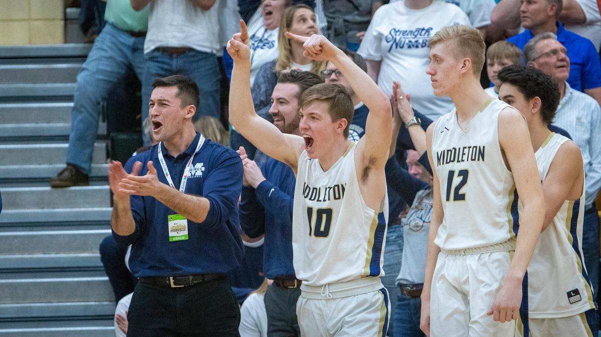Tate Johansen (10) celebrates as the game ends and Middleton takes the 49-44 win over Bishop Kelly in the first round of the 4A boys basketball state tournament Thursday at Borah High.
