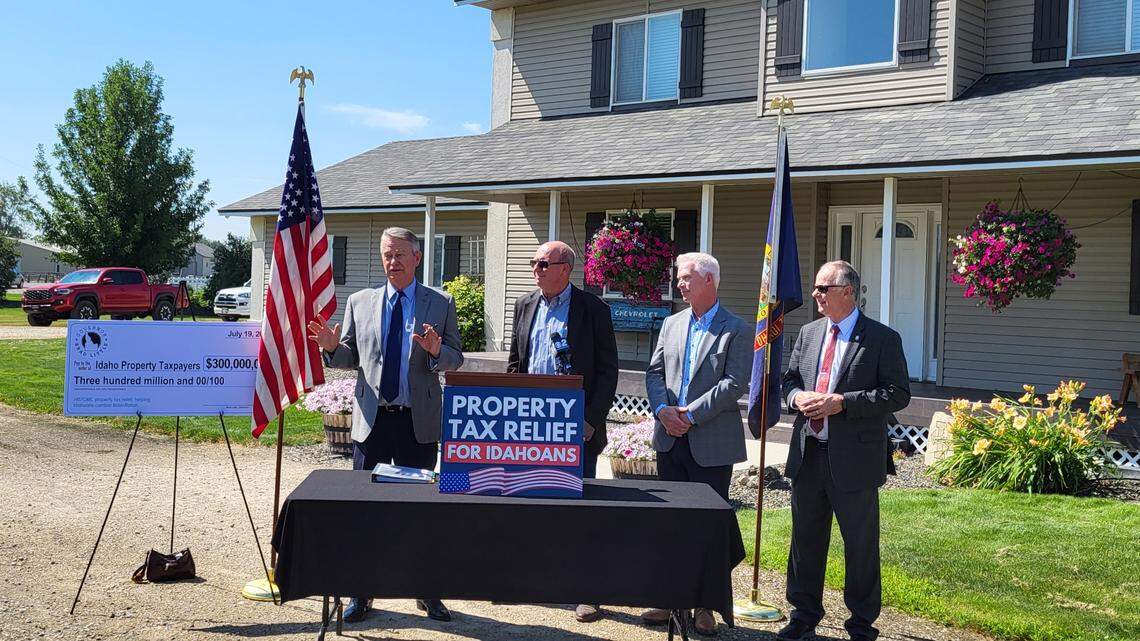 Idaho Gov. Brad Little, far left, announced Idahoans will see $300 million in property tax relief this year outside a Nampa home Wednesday, July 19, 2023. House Speaker Mike Moyle, R-Star (second to left); Rep. Jason Monks, R-Meridian; and Sen. Doug Ricks, R-Rexburg (far right), attended the news conference alongside Little.