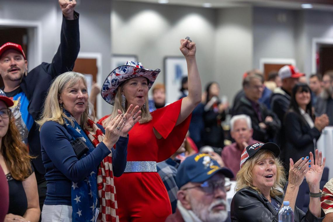 Vicki Lindgren, Eagle, and Megan Kiska, Boise, right, cheer as results are posted while attending the Republican election night party at The Courtyard by Marriott in Meridian.