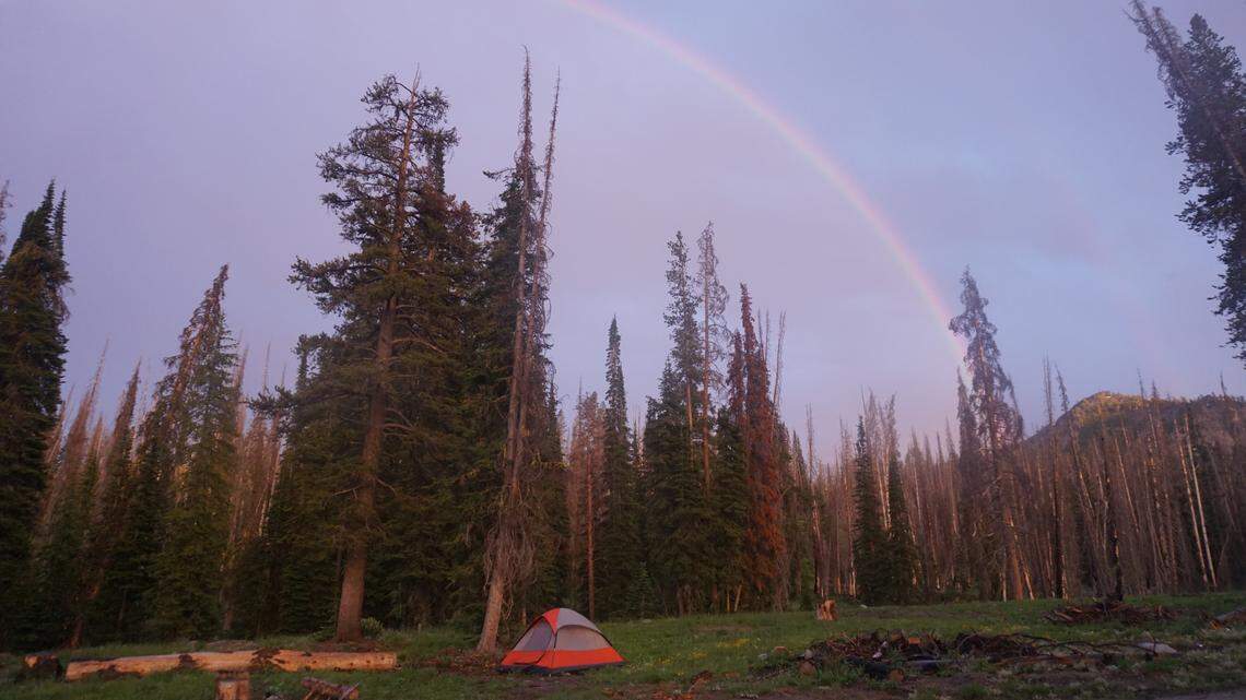 A rainbow is visible over outdoor reporter Nicole Blanchard’s tent near Big Trinity Lake in this 2019 file photo. Tent camping has brought increasing annual revenue to Idaho since record-keeping on outdoor economics began in 2017.