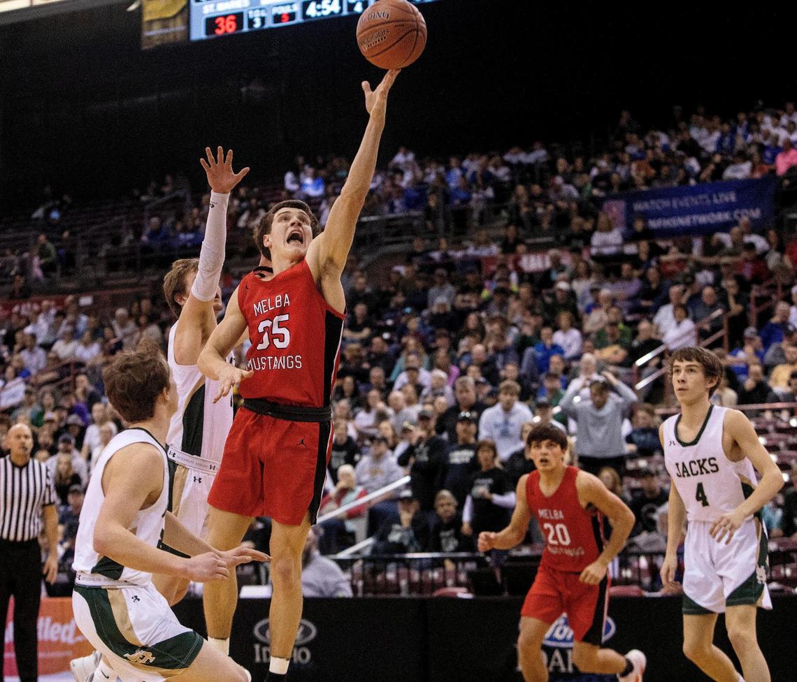 Melba senior Joe Reiber makes a basket in the first half against St. Maries. Reiber scored 22 points.