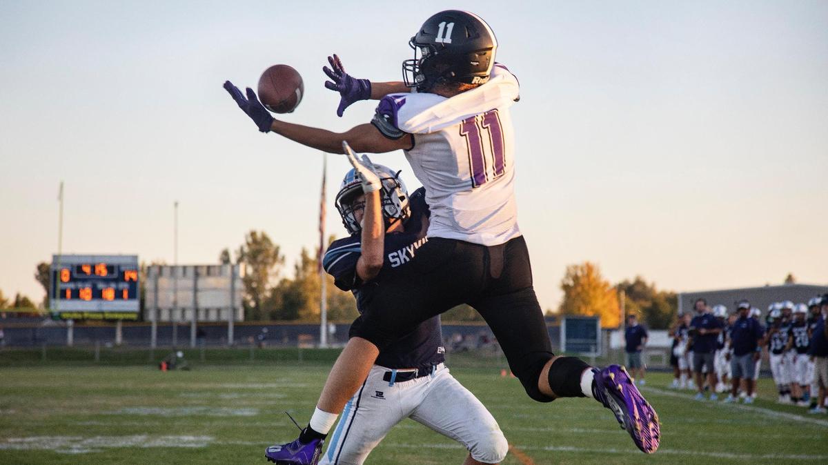 Skyview’s Johnny Iordanescu can’t stop Rocky Mountain’s Luke Luchini from making the catch for a touchdown in the first half of their game Friday in Nampa.