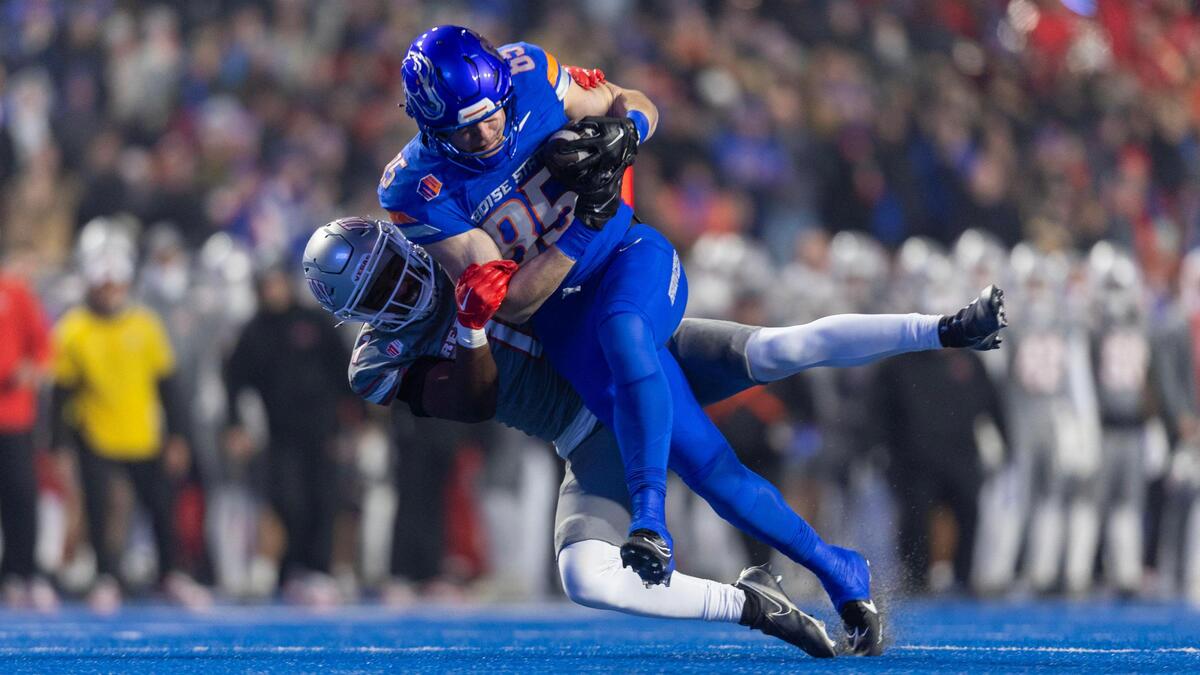 Boise State tight end Matt Lauter is tackled by UNLV defensive back Jalen Catalon after a 40-yard reception in the Mountain West championship game last season.