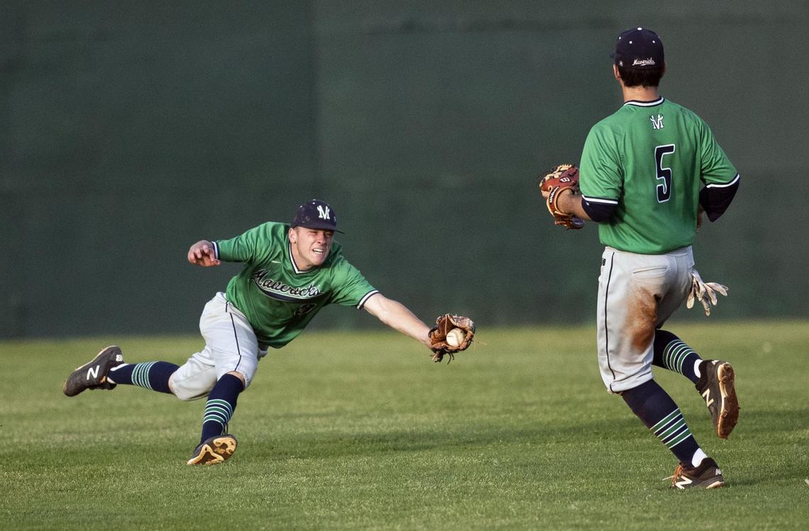 Mountain View outfielder Blake Jablonski stops a hit to left field during the Mavericks’ 19-2 state championship win over Capital Saturday, May 18, 2019 at Memorial Stadium in Boise.