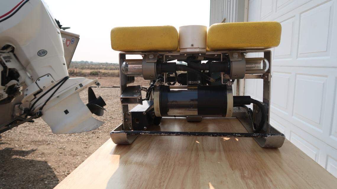 A Remotely Operative Vehicle (ROV) has a camera, four thrusters and a hand-like add-on that can grab a human wrist and bring a body to the surface.