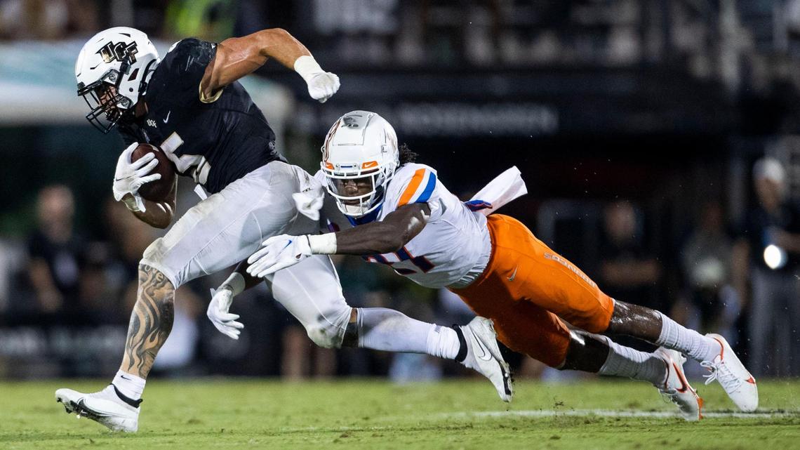 Boise State safety Tyreque Jones tries to tackle UCF running back Isaiah Bowser during the Broncos’ season opener last September. Jones finished the season with a career-high 53 tackles.