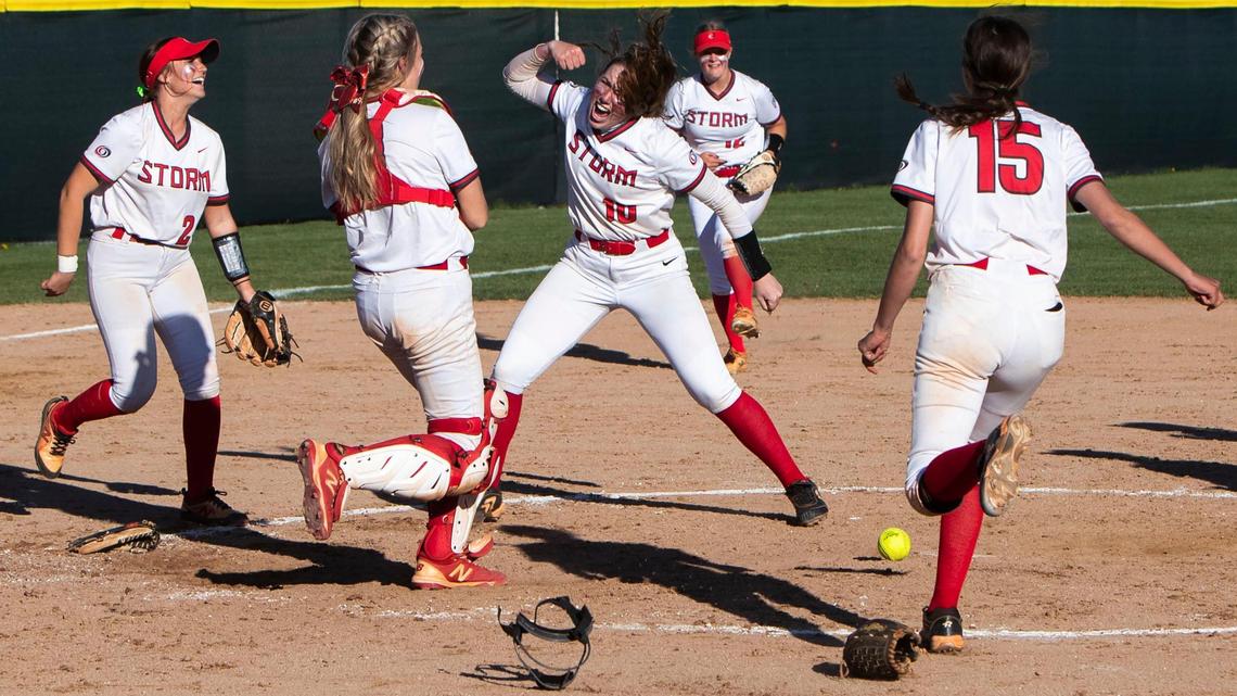 Owyhee pitcher Grace Brooks becomes the eye of the Storm’s celebration after defeating Eagle 7-5 in the 5A District Three softball championship game Friday at Borah High.
