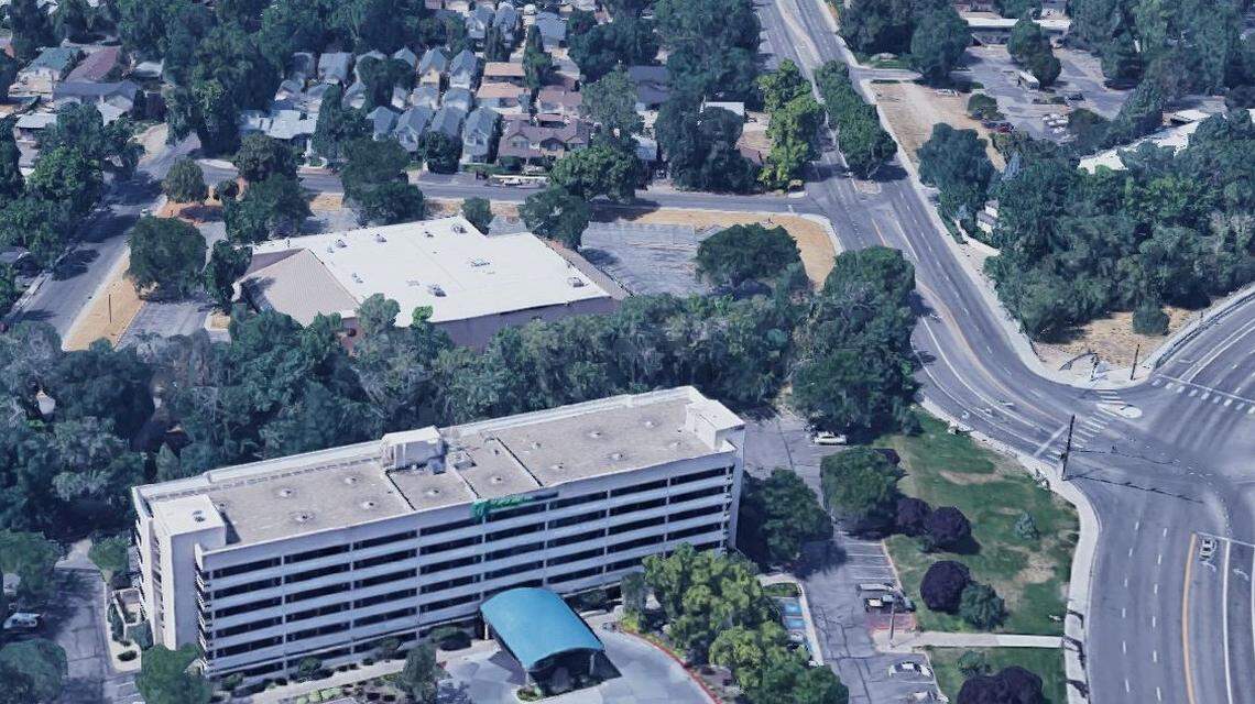 Storage Development is seeking to build a four-story apartment complex at South Division Avenue and West Beacon Street, at the site of the sand-colored building in the center of this image. Neighbors said the building would overwhelm one- and two-story homes and townhouses across Division, the street going left to right at the top of the photo. Beacon Street is at the right and connects to Division and West Parkcenter Boulevard, right.