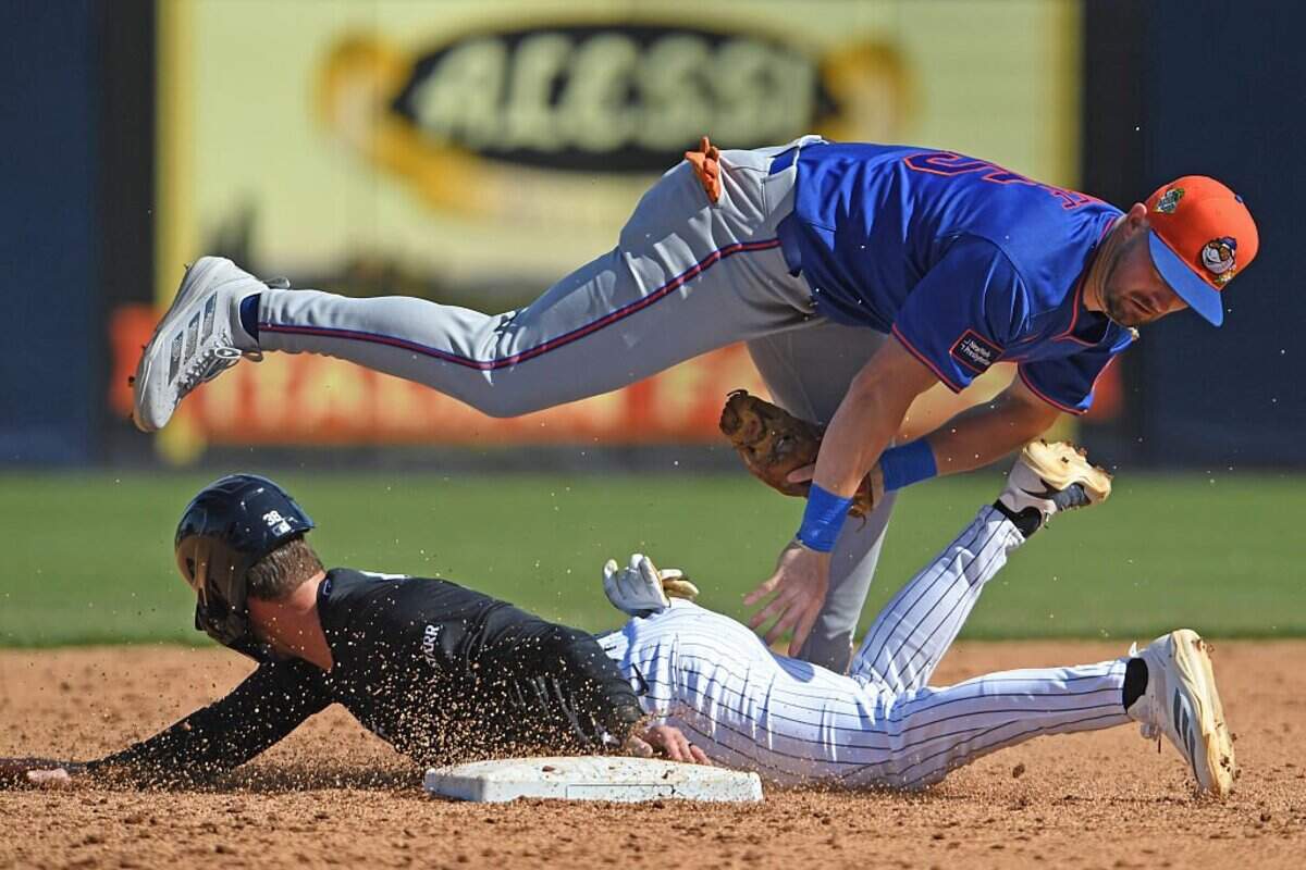 TAMPA, FLORIDA - FEBRUARY 22: Zack Short #38 of the New York Yankees is caught stealing by Jackson Cluff #85 of the New York Mets during the sixth inning of a spring training game at George M. Steinbrenner Field on February 22, 2026 in Tampa, Florida. (Photo by Mark Taylor/Getty Images)