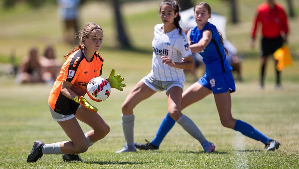 Idaho Rush goalkeeper Marin MacKenzie secures the ball after a Utah Surf shot Friday during the U-15 girls Far West Regional quarterfinals at the Simplot Sports Complex in East Boise.