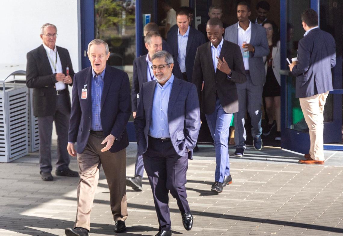 Micron Technology CEO Sanjay Mehrotra talks with U.S. Sen. Mike Crapo, R-Idaho, on a tour of the ongoing construction of a new $15 billion fab facility in Boise, Monday, June 10, 2024.