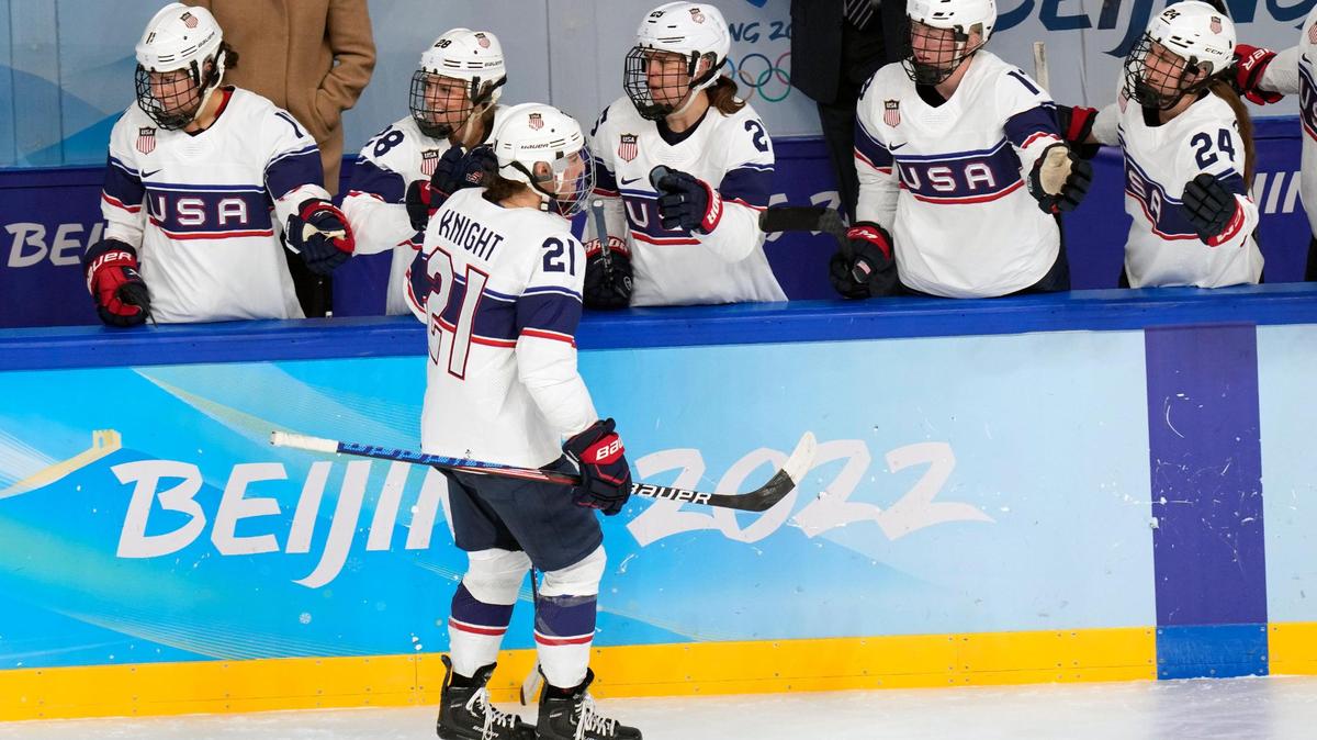 Hilary Knight is congratulated by teammates after a first-period goal Sunday against Switzerland.