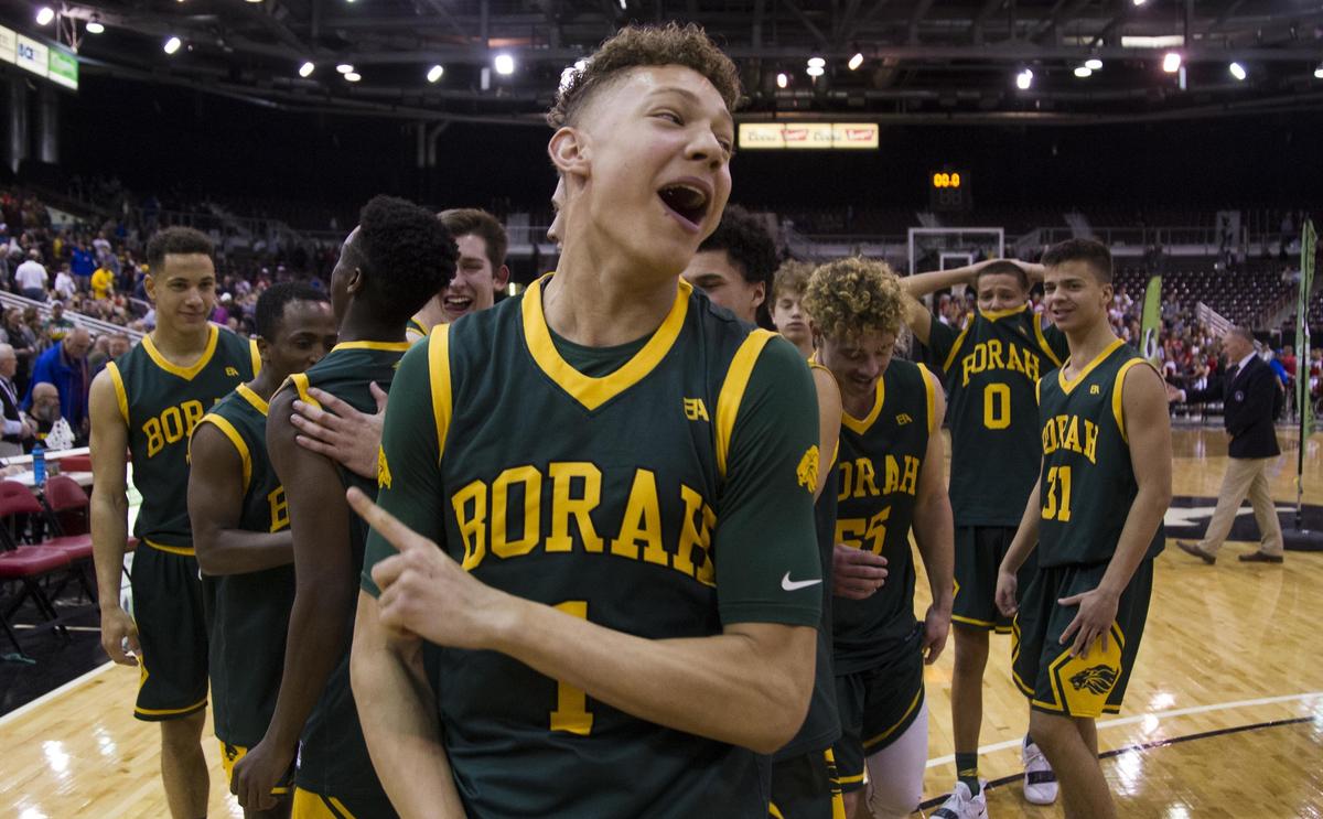 Borah senior Caleb Golden and the Lions celebrate winning the state 5A boys basketball championship Saturday, March 2, 2019 at Ford Idaho Center in Nampa.