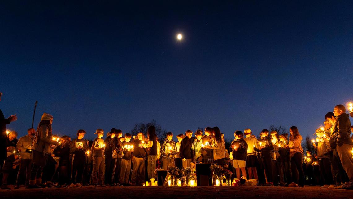 Friends and family gather on the Hillside Junior High baseball diamond in November for a candlelight vigil remembering the life of a Boise student who died by suicide.