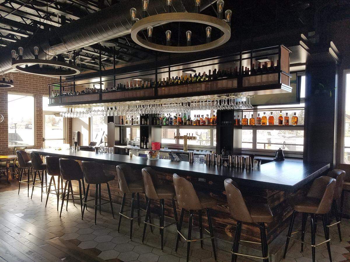 Whiskeys and other libations line shelves behind the bar at The James.
