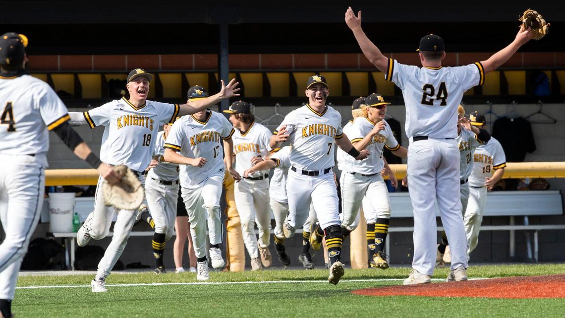 Bishop Kelly rushes the field Saturday, greeted by pitcher Colin Dempsey, after defeating Twin Falls 15-0 in the 4A state championship game.
