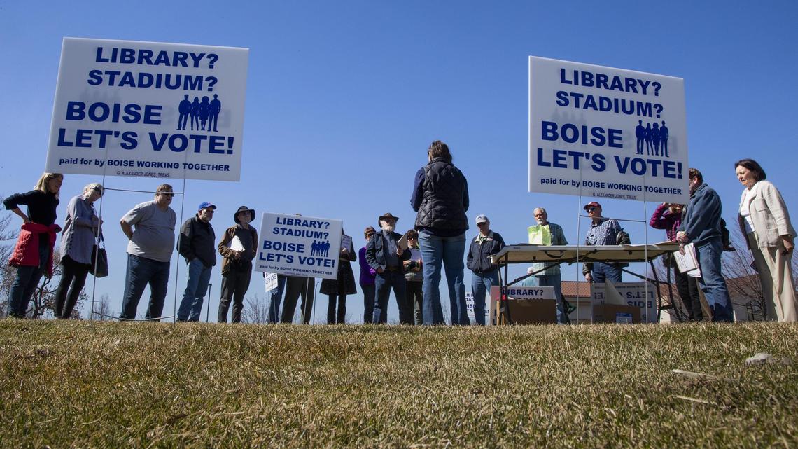 A group of about two dozen Boise residents who want voters to decide on a new library and stadium in Boise, gather at park along Vista Avenue Saturday, March 16, 2019, to begin a signature drive to add two initiatives to the November ballot.