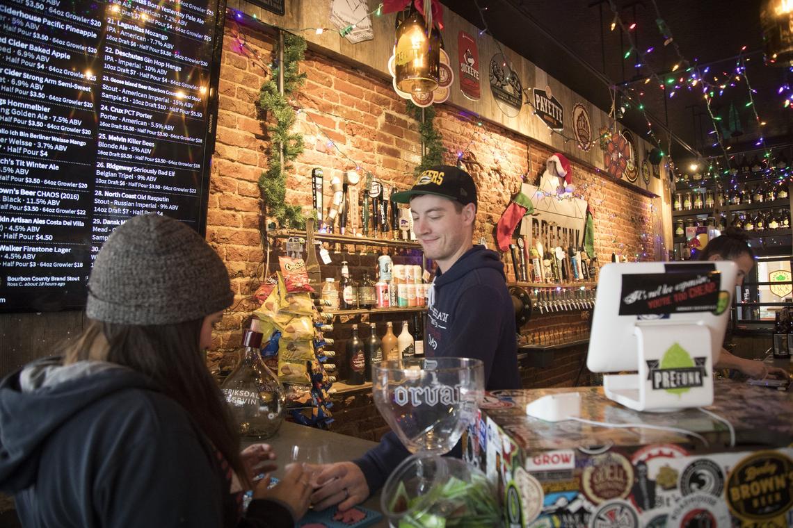 Bartender Corbin Wise serves up an afternoon glass of wine at PreFunk, which has been an anchor business in downtown Nampa for four years.