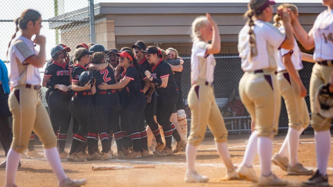 Owyhee players celebrate after Brooklyn Schneidt hit a home run to end the 5A state championship game in the sixth inning. Owyhee defeated Rigby 13-3.