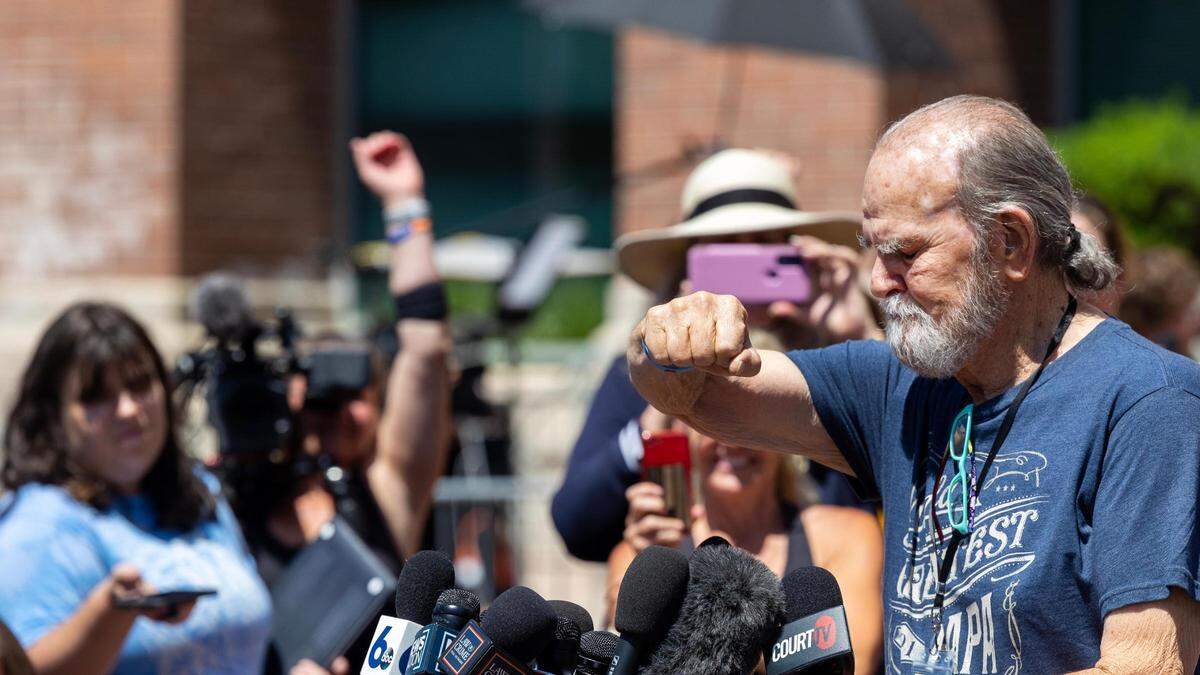Larry Woodcock holds up his closed fist in a gesture to his grandson, JJ Vallow, on Friday outside of the Ada County Courthouse in Boise after the verdict in the Lori Vallow Daybell trial.