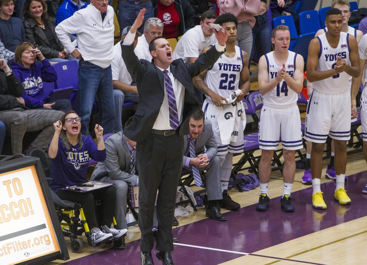 College of Idaho men’s basketball coach Colby Blaine gets the crowd pumped up in one of two overtimes against NNU on Nov. 13, 2018, in Caldwell.