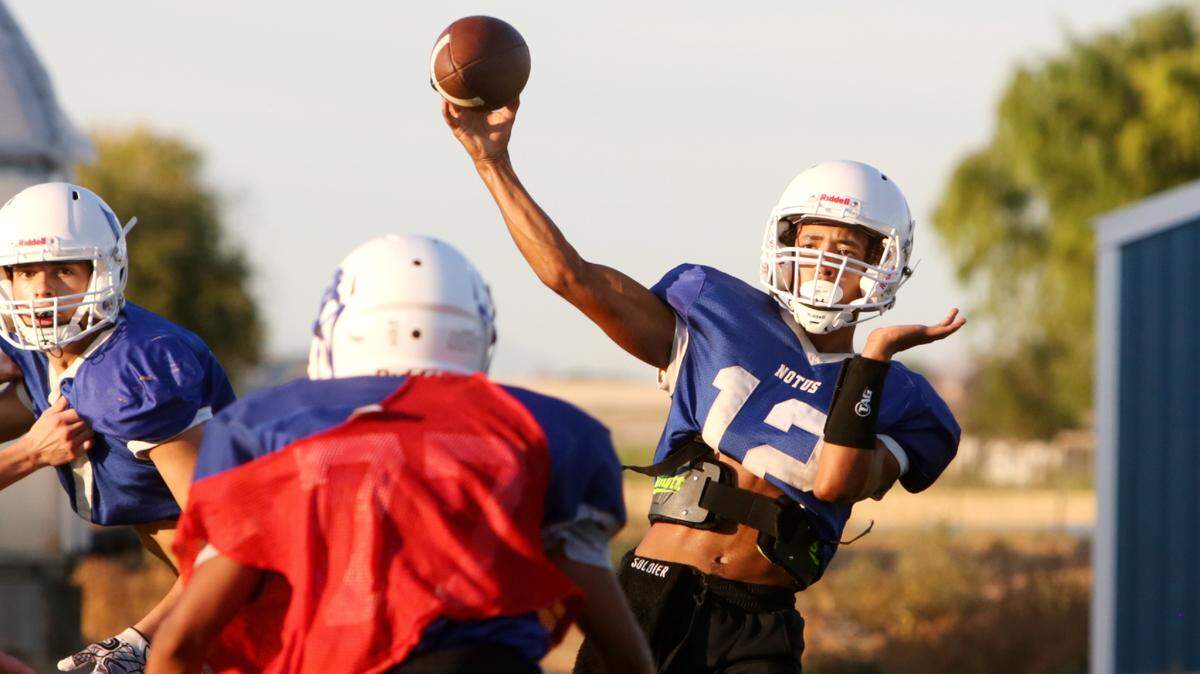 Sophomore Benny Guevara, right, takes over the starting quarterback position for Notus this fall after the graduation of Kaeden Clemens.