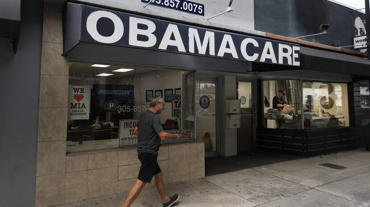 MIAMI, FLORIDA - NOVEMBER 12: An Obamacare sign is displayed outside an insurance agency on November 12, 2025 in Miami, Florida. House Democrats are said to be looking at steps to force a vote on extending the expiring Affordable Care Act tax credits after Republicans did not address the issue as part of a deal to reopen the federal government. The House is expected to vote today on ending the record-long government shutdown. (Photo by Joe Raedle/Getty Images)