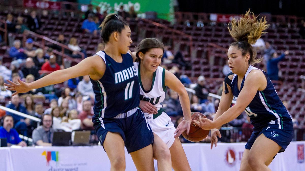 Mountain View guard Trinity Slocum strips the ball from Eagle’s Betsey King during the 5A girls basketball state semifinals Friday at the Ford Idaho Center in Nampa.